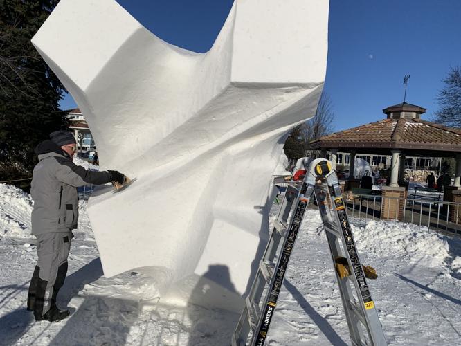Ceyhun Konak works on his team's sculpture entitled, "Organic Cubes"