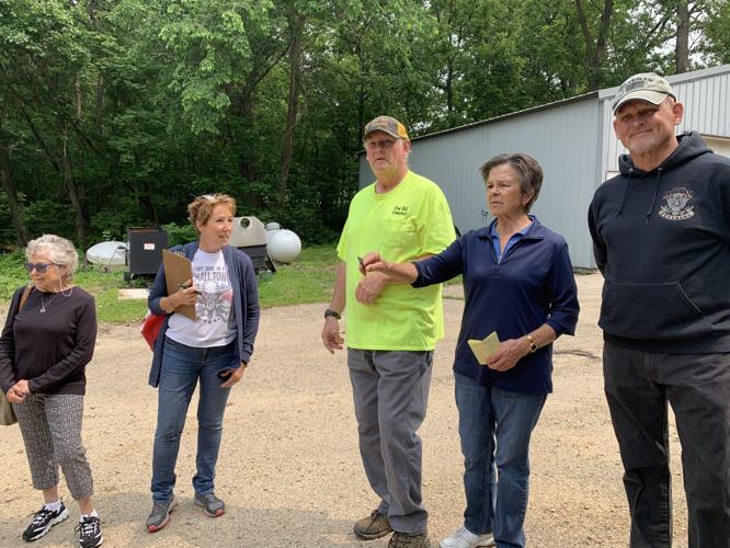 Members of the Cemetery Board and staff look over a potential area to construct a new storage building