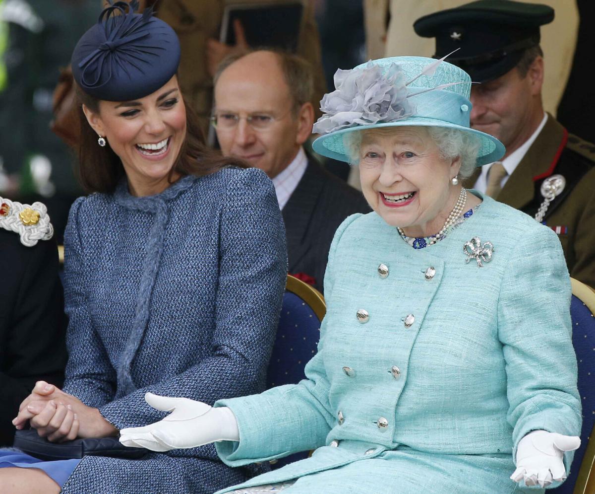 The Duke looks on laughing as Nkrumah asks the Queen to Dance