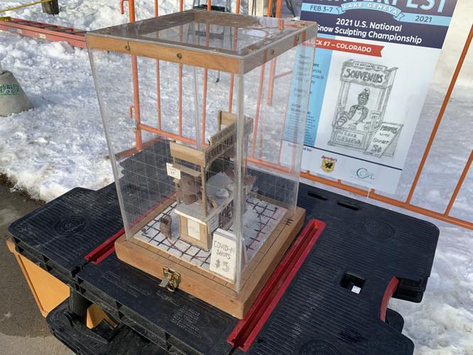 A Colorado team displays a model of the sculpture they plan to work on during the U.S. National Snow Sculpting Championship