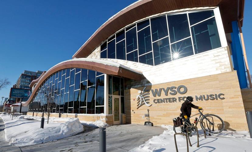 Exterior of WYSO building with bicyclist parking