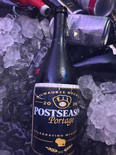 Bottles featuring the names of Wisconsin towns were used in the celebration after the Milwaukee Brewers defeated the San Diego