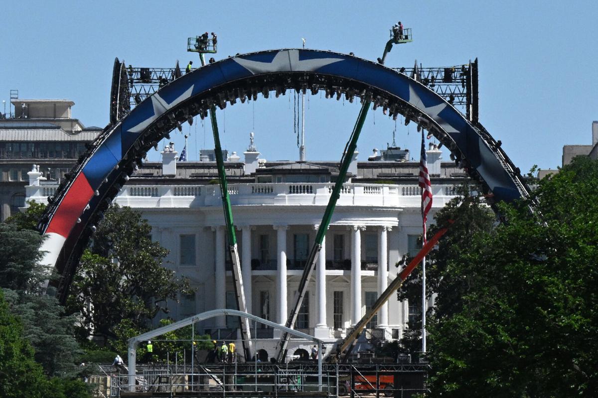 Cranes work on the construction of a structure on the South Lawn of the White House in Washington, D.C., on May 29, 2026, for the upcoming UFC fight that President Donald Trump will host as part of the 250th anniversary of the United States. It has play...
