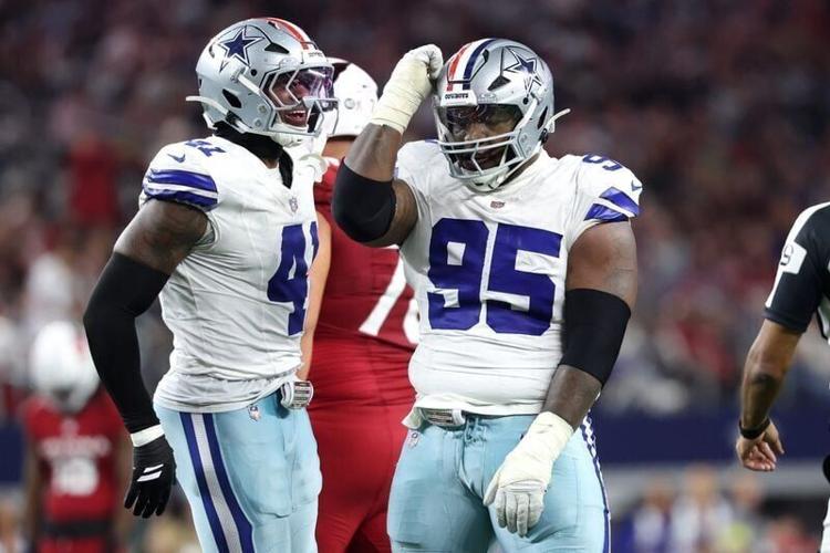 Nov 3, 2025; Arlington, Texas, USA; Dallas Cowboys defensive tackle Kenny Clark (95) and defensive end Donovan Ezeiruaku (41) celebrate after a sack Arizona Cardinals quarterback Jacoby Brissett (7) in the second half at AT&T Stadium. Mandatory Credit: ...