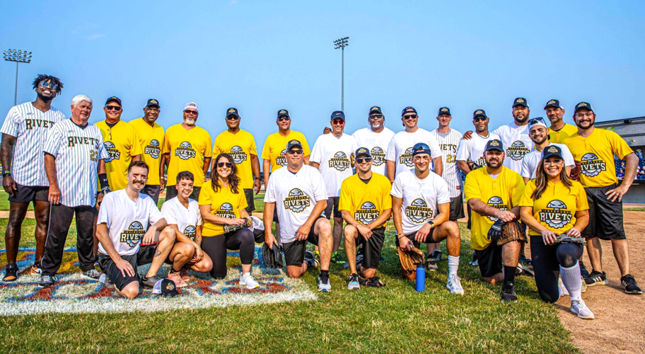 Inaugural Rockford Rivets Legends Celebrity Softball Game players gather for a group photo
