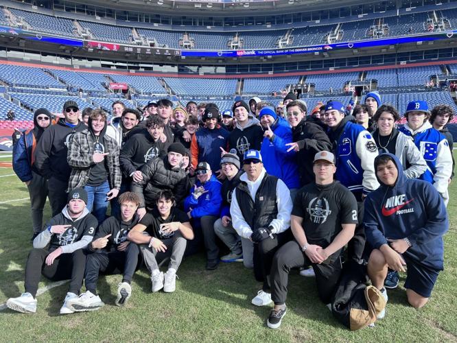 LaCrue team photo with Russell Wilson