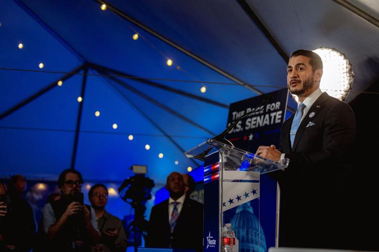 Democratic US Senate candidate Abdul El-Sayed and his Republican rival Mike Rogers take part in a debate in Grand Rapids, Michigan