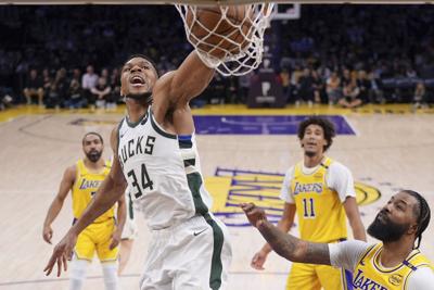 Giannis dunks, Lakers watch, AP photo