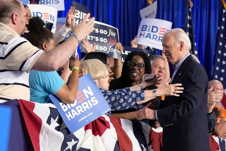 Biden supporters greet the president