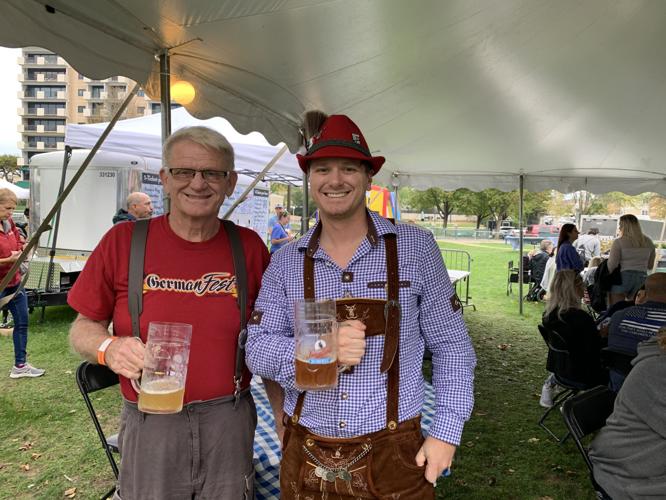 Father-and-son team Michael Baker and Zach Baker enjoy Oktoberfest