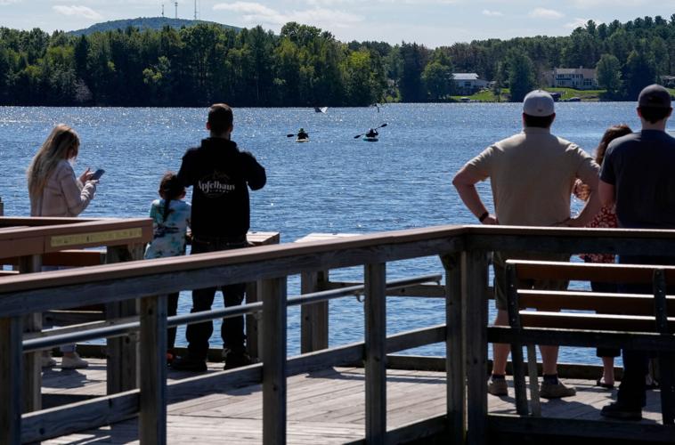 Bystanders get a look at Republican gubernatorial nominee Tom Tiffany's plane on Sunday, Sept. 13, 2026, at Lake Wausau in