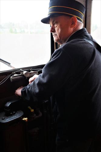 East Troy Electric Railroad Motorman Evan Richards keeps a watchful eye approaching a grade crossing