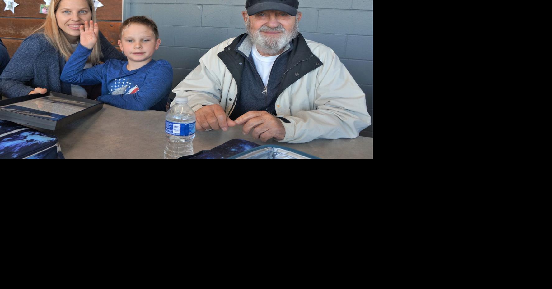 U.S. Navy veteran Ted Scholtz enjoys lunch with his family at Williams