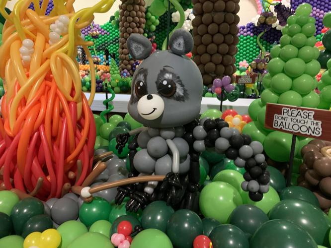 A racoon is roasting some marshmallows during one of the nature scenes
