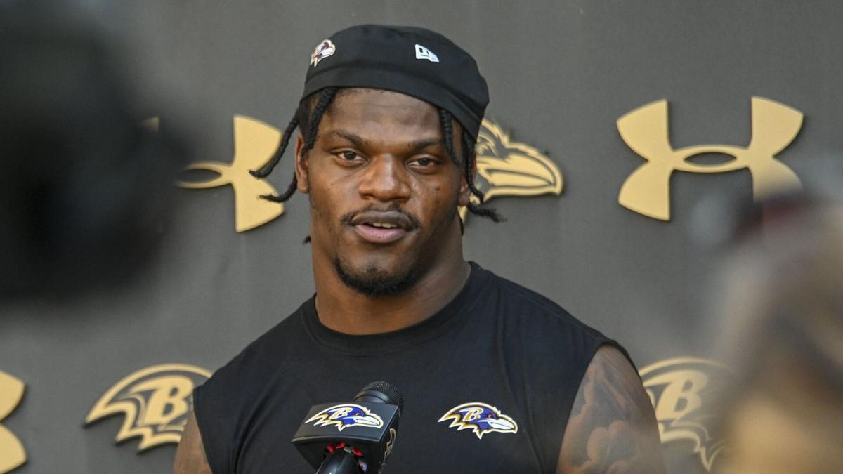Ravens quarterback Lamar Jackson answers questions from the media after practice in September.