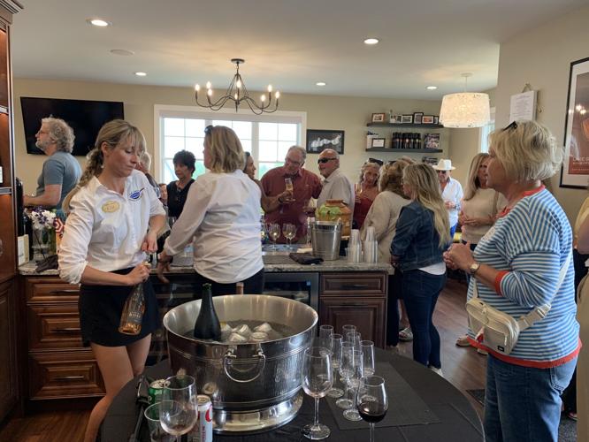Lake Geneva School of Cooking staff prepare drinks for guests