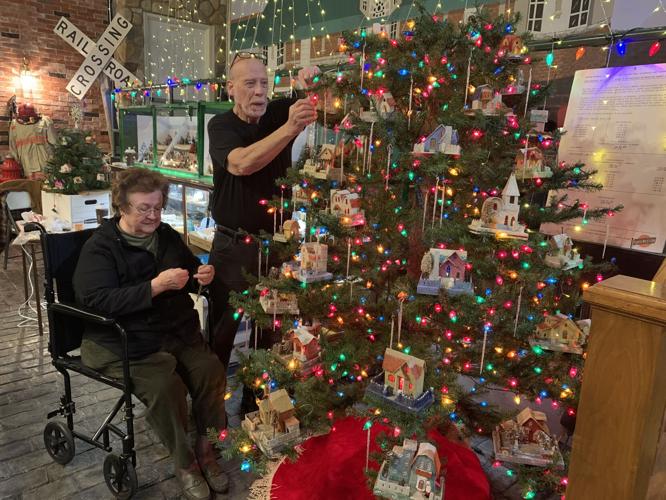 Peter Oehmen and Linda Starek decorate their tree with "putz houses"