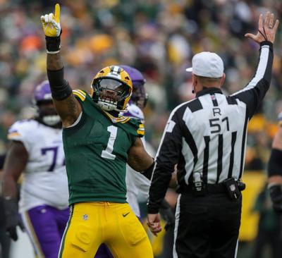 Green Bay Packers defensive end Micah Parsons (1) celebrates after sacking Minnesota Vikings quarterback J.J. McCarthy on