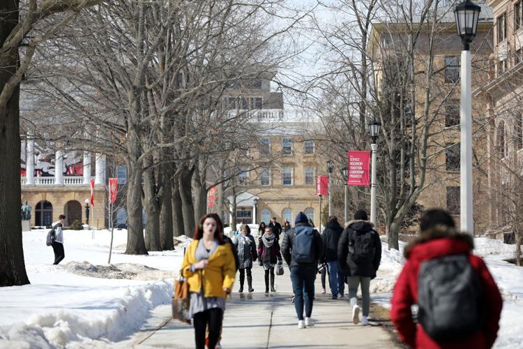 UW-Madison students walk down Bascom Hill