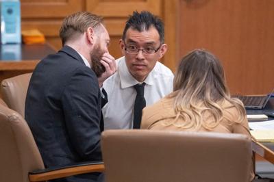 California attorney and animal rights activist Wayne Hsiung, center, appears in Dane County Court Wednesday, April 29, 2026 in Madison, Wisconsin. He is charged with felony burglary for allegedly breaking into Ridglan Farms, which breeds beagles for sal...