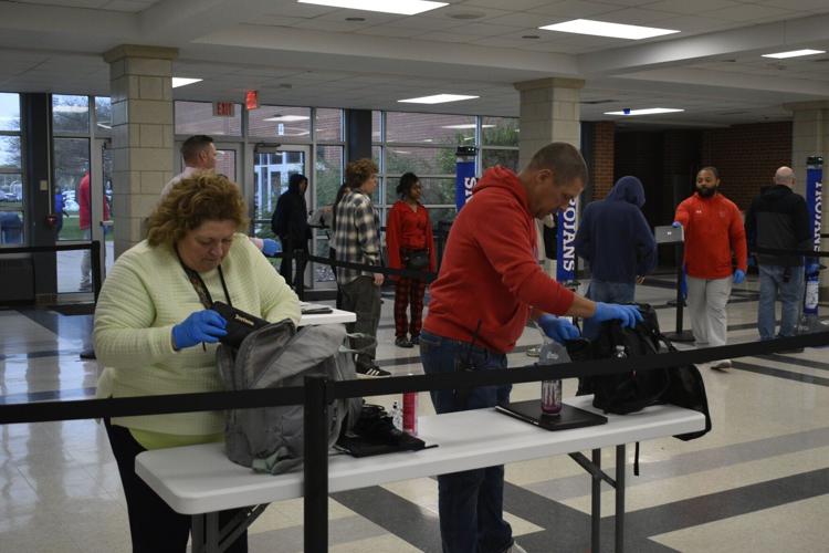 Tremper staff operate metal detectors