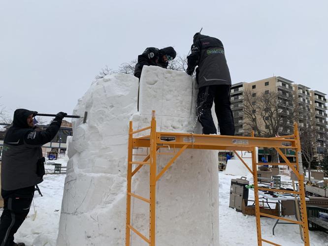 Wisconsin snow sculpting team "Sculptura Borealis" begin work on their sculpture