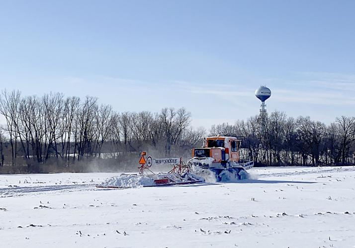 Grooming the snowmobile trail