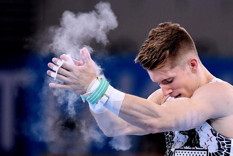 The United States' Shane Wiskus celebrates after competing on the high bar during Men's Team Gymnastics qualifying at the 2020 Tokyo Olympics on Saturday, July 24, 2021, in Tokyo.