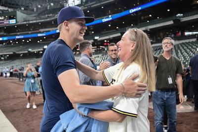 Brewers rookie shortstop Cooper Pratt is greeted by his mother, Heidi Pratt, before making his major league debut against the Guardians on Tuesday, June 16 at American Family Field.