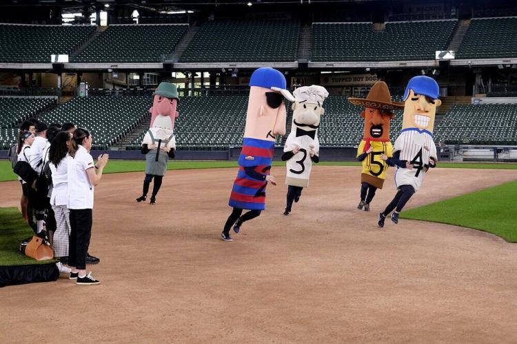 The "cheftestants" cheer during their own private sausage race