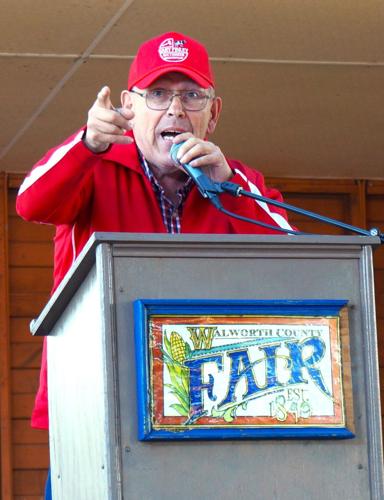 Auctioneer Gary Finley presides over the 2023 Fairest of the Fair pie action fundraiser