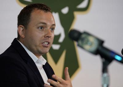 Jon Horst at intro newser, AP photo