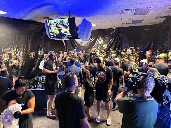 The Milwaukee Brewers celebrate after winning the National Leaghe Central Division for a fourth straight season in Pittsburgh.