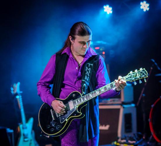 Tallan Noble Latz plays the guitar