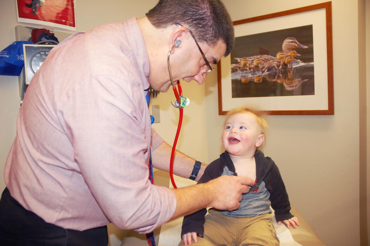 Dr. Joe Klawitter with infant Beau Kibler at hospital