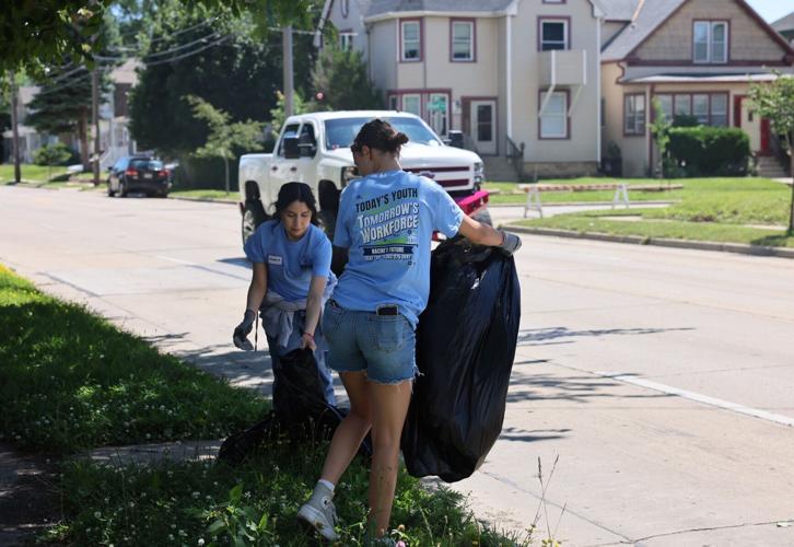 Violet DeSonia and Vanessa Rivas pick up trash