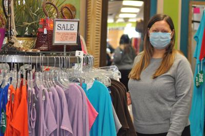 Katie Urban, store manager at Oh My Gauze in downtown Lake Geneva, stands next to clothing items