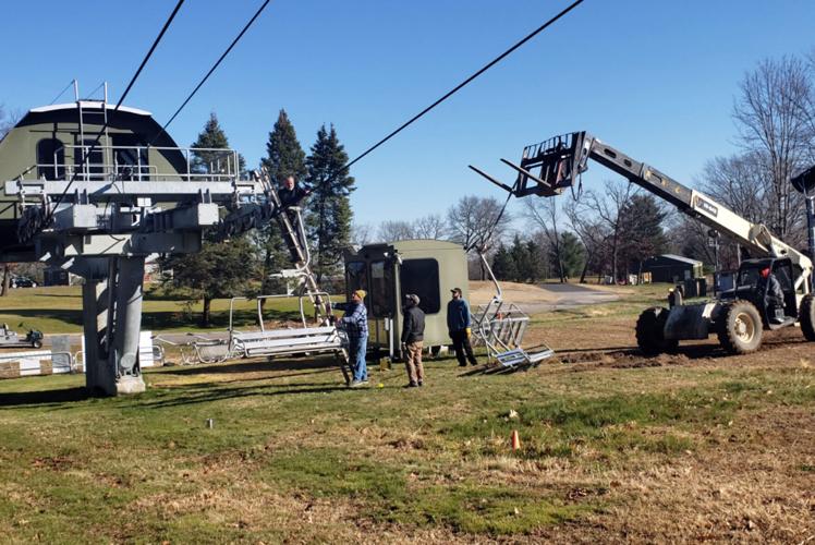 Christmas Mountain staff assembles ski lift