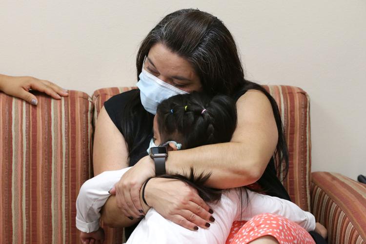 Jennifer hugging daughter