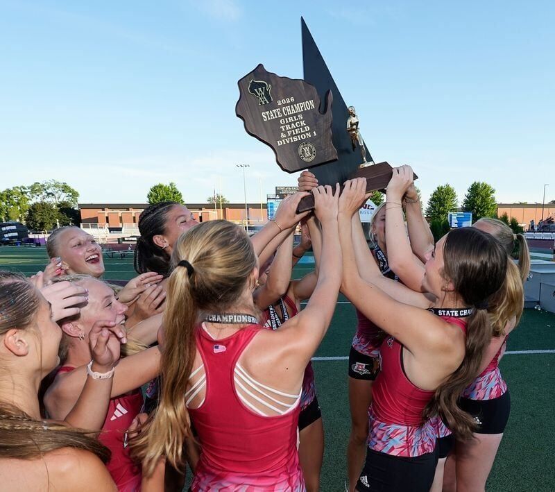 Arrowhead High School girls track team holds up the WIAA Division 1 State Track and Field championship trophy in La Crosse, Wisconsin on Saturday, June 6, 2026.