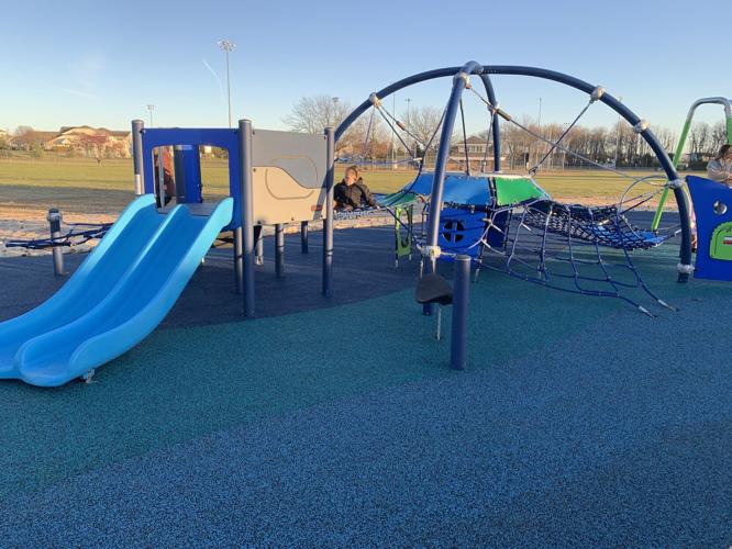The new playground includes a "mini-dome" that features a climbing area and a slide