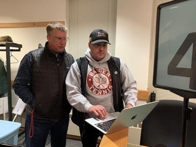 Mayor Todd Krause and Superintendent Peter Wilson look over the results of the April 1 spring election