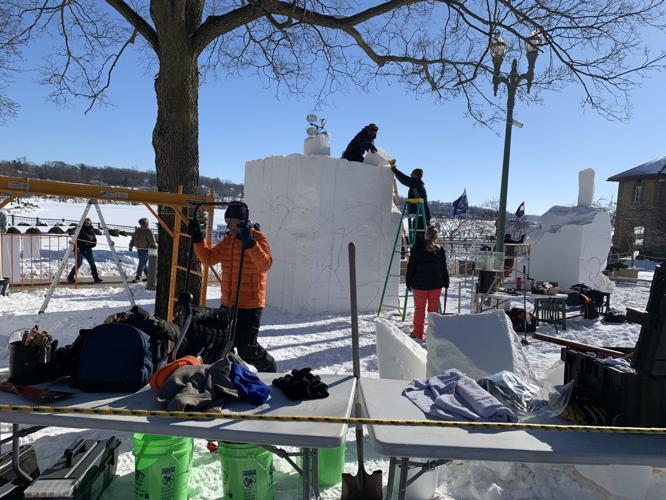 Teams begin working on their snow sculptures, Feb. 1, at Riviera Plaza