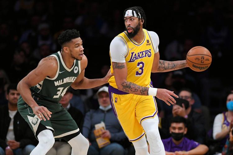 Giannis Antetokounmpo guards Anthony Davis, AP generic file photo