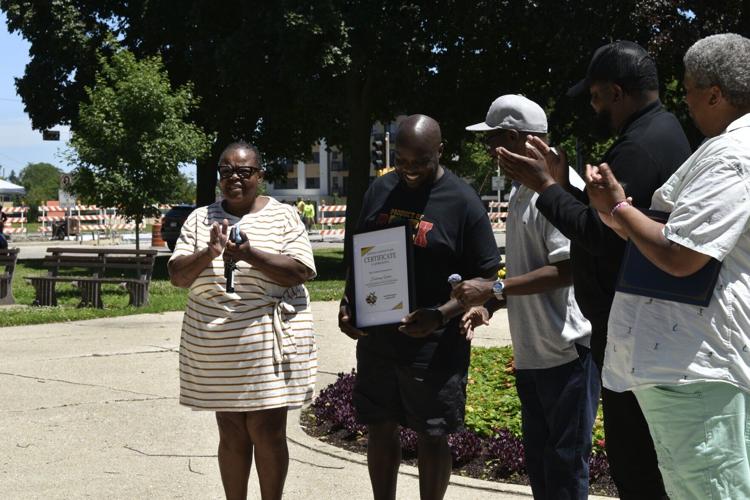 Deshaun Foster receives certificate at Juneteenth ceremony