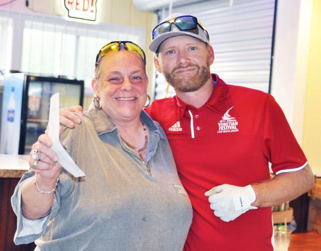 Jeanne Cizon and Nate Love donatioin from Jaycees to food pantry