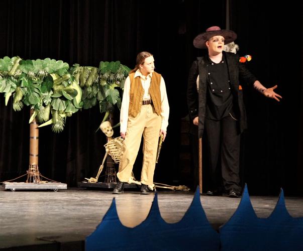 Young Jim Hawkins and Long John Silver on Skeleton Island during the hunt for buried treasure