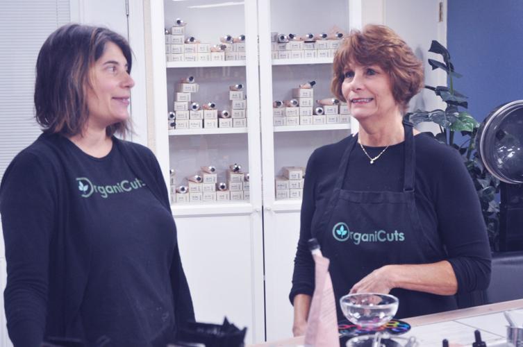 Elizabeth Krause, left, and her mother, Lea Boukidis, have a discussion at Krause's business