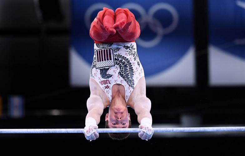 The United States' Brody Malone competes on the high bar during Men's Team Gymnastics qualifying at the 2020 Tokyo Olympics on Saturday, July 24, 2021, in Tokyo.