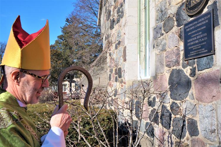 The Rt. Rev. Jeffrey D. Lee says a prayer of blessing during a Nation Register plaque dedication at Episcopal Church of the Holy Communion, 320 Broad St., Lake Geneva